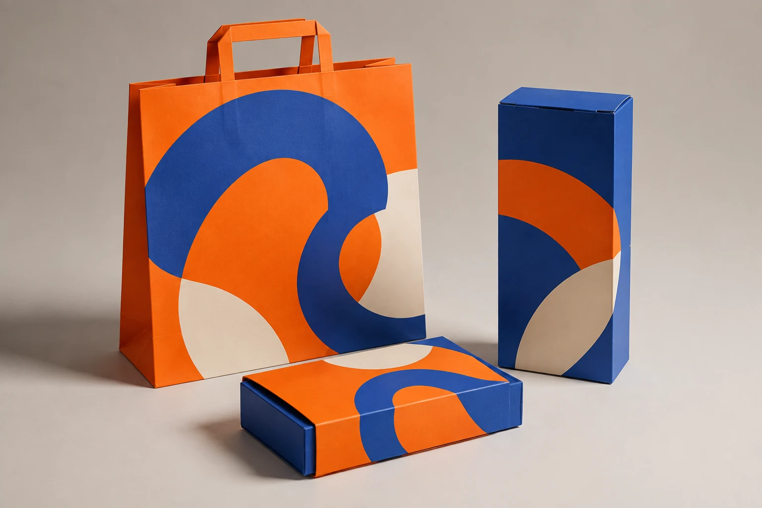 Expressive study: shopping bag, carton and sleeved box coordinated in orange and cobalt